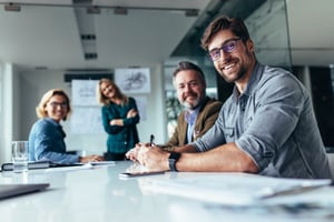 Happy group of businesspeople during presentation