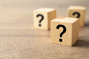 Question marks on wooden cubes