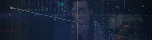 Monitoring IT specialists wearing shirts analyzing code