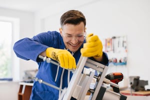 Young engineer wearing protective glasses and gloves